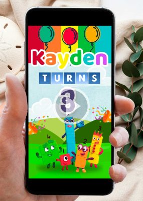Animated Numberblocks birthday video invitation showing characters 1, 2, and 3 in a mountain landscape with colorful balloons.